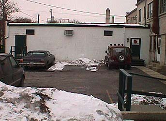 Here is our white building with the green doors, located behind the main building.